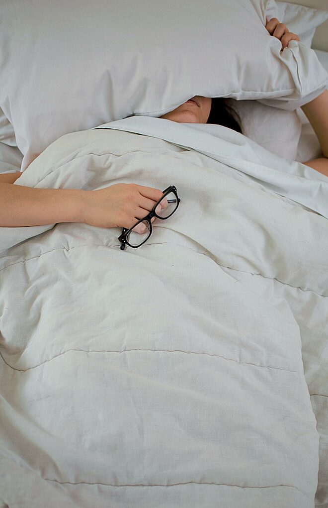 Ziek in bed liggend